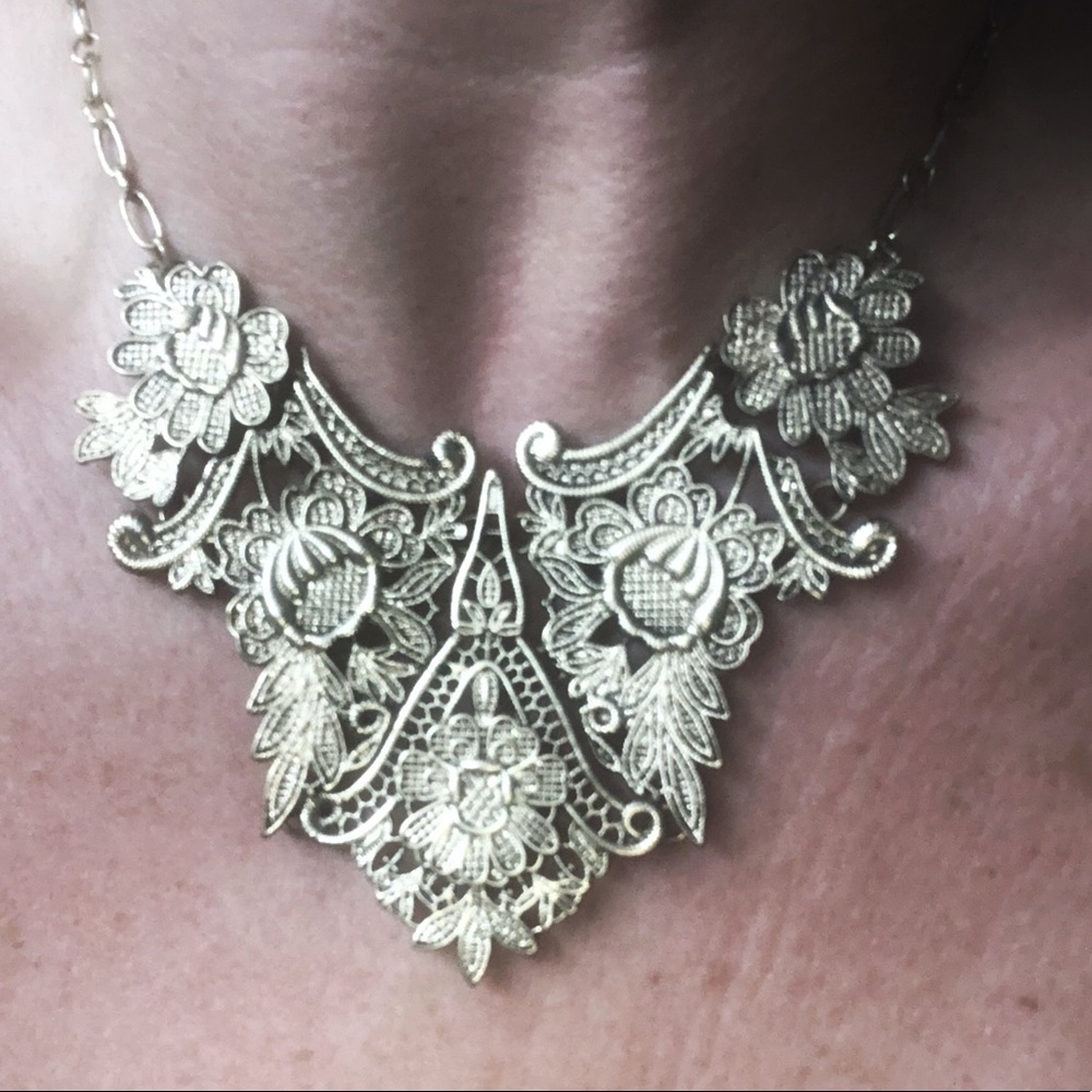 Gold toned, antique style bib necklace